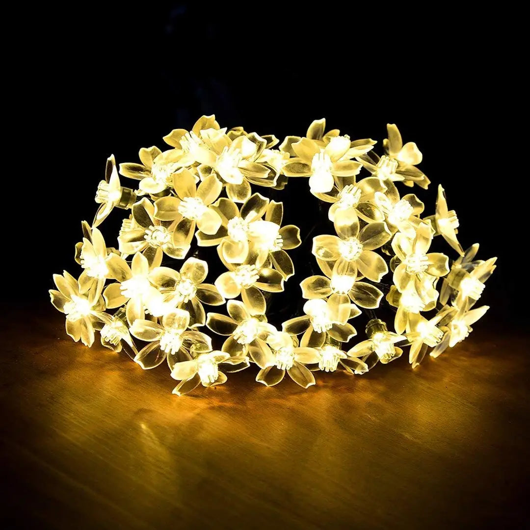 NOVALUC 40 Led Blossom Flower Decoration Lights Plug In Fairy String Lights (6 Meters, Steady,Warm White)(Pvc + Copper)